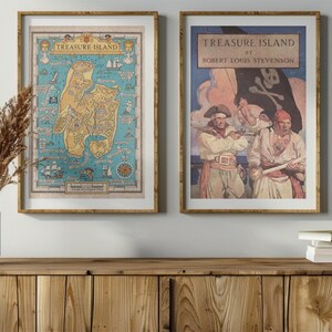 May include: Two framed prints of Treasure Island by Robert Louis Stevenson. The left print is a map of the island, and the right print features a pirate scene with three pirates.