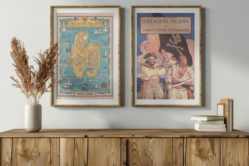 May include: Two framed prints of Treasure Island by Robert Louis Stevenson. The left print is a map of the island, and the right print features a pirate scene with three pirates.