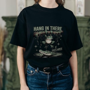 Hang in there...it gets worse &quot; dark humor forg and crocodile tee