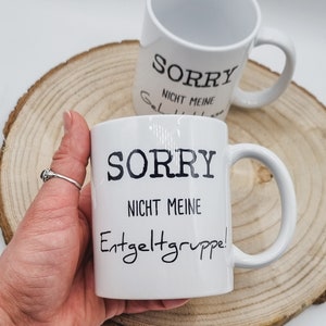 Weiße Kaffeetasse mit lustigem Aufdruck.