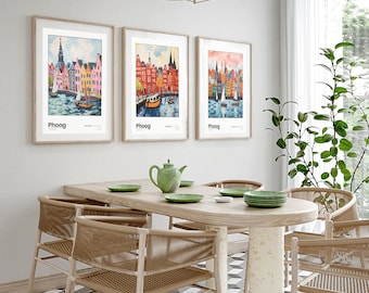 May include: Three framed prints of colorful cityscapes with boats in the water. Each print has the word "Phoog" at the bottom. The prints are hanging on a white wall above a wooden table with four chairs.