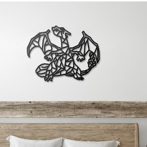 May include: Black metal wall art featuring a geometric dragon design. The dragon is in a curled position with its wings spread out. The art is mounted on a white wall above a wooden headboard.