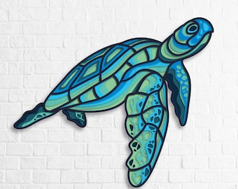 Pode incluir: Um recorte de papel azul e verde de uma tartaruga marinha com detalhes intrincados. A tartaruga está virada para a direita e tem uma carapaça e barbatanas detalhadas.