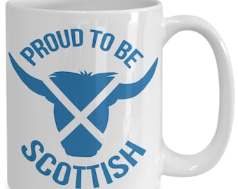 May include: White ceramic mug with a blue silhouette of a Scottish Highland cow with a blue Scottish Saltire cross over the head. The text "Proud to be Scottish" is written in a blue semi-circle around the cow.