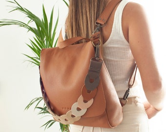 Leather sling backpack for versatile use. Compact small backpack for daily essentials. Laptop bag with secure compartments. 7 colors. LEA
