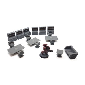 May include: A set of 10 grey plastic miniature furniture pieces, including desks, chairs, and a sofa, for use in tabletop games or dioramas. A miniature space marine figure stands in the centre.