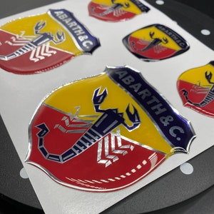 SET ACCESSORI ABARTH COPRI CINTURE + COPRI VALVOLE + STEMMI STICKERS TUNING