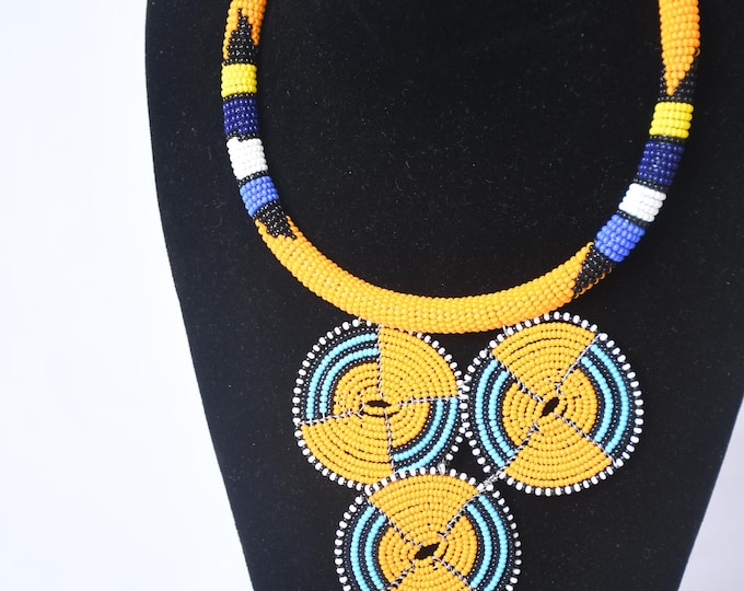 On SALE  Vibrant Orange Beaded Necklace with Blue & Black Disc Pendants - Handcrafted Art| Stylish | Gift for Her | Masai Mara