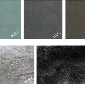 May include: A collection of fabric swatches in various colors, including sand, mint, grey, brown, and black. The image also features a light and dark textured fabric. Each swatch is labeled with its corresponding color name in white text.
