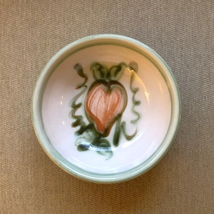 May include: A set of three ceramic nesting bowls in shades of blue, green, and white. The bowls feature a speckled glaze and a simple, modern design. The largest bowl is approximately 6 inches in diameter.