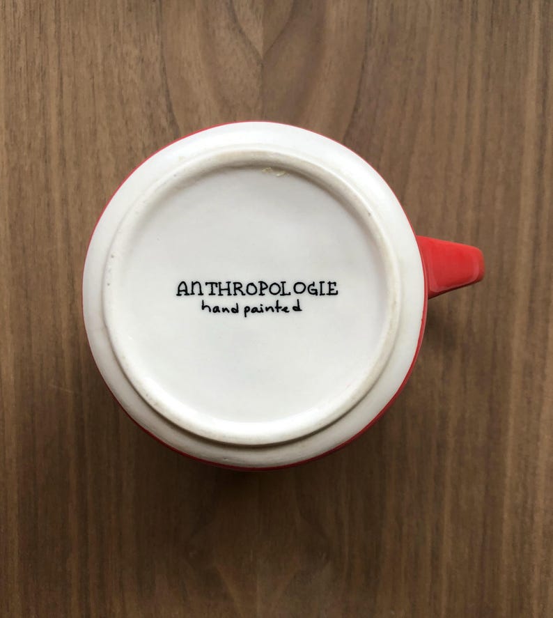 May include: A set of three ceramic mugs with a speckled, matte finish. The mugs are in shades of cream, light gray, and dark gray. Each mug has a simple, minimalist design, perfect for coffee or tea.