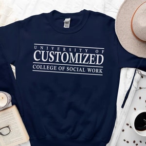 May include: A navy blue sweatshirt with white text that reads "University of Customized College of Social Work".
