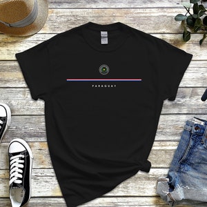 May include: Black t-shirt with a white stripe and the text "PARAGUAY" below a green and white circular emblem.