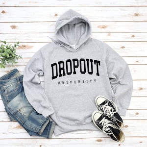 May include: A gray hooded sweatshirt with the text "DROPOUT UNIVERSITY" printed in black on the front.