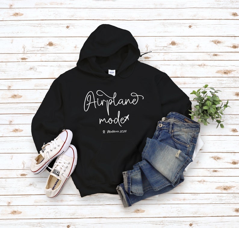 May include: Black hoodie with white text that says "Airplane mode" and a small airplane icon. The text also includes "Maldives 2019".