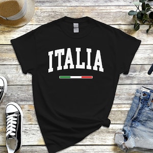 May include: Black t-shirt with white text that says "ITALIA" and a green, white, and red stripe underneath.