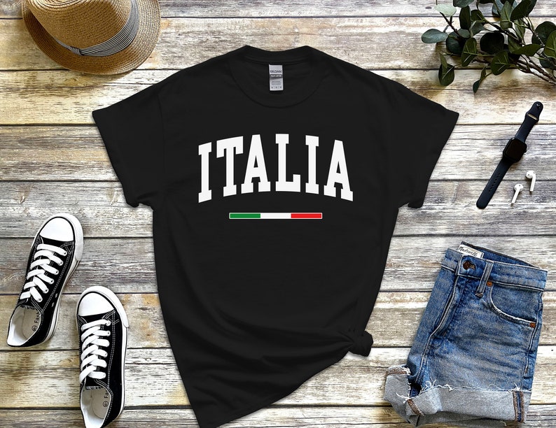 May include: Black t-shirt with white text that says "ITALIA" and a green, white, and red stripe underneath.