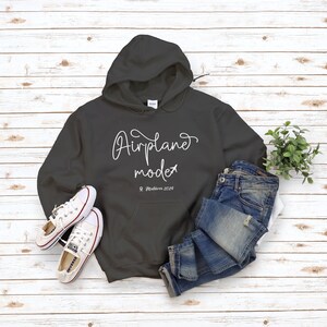 May include: A dark gray hooded sweatshirt with the text "Airplane mode" and a small airplane icon. The text "Maldives 2019" is written below the main text.