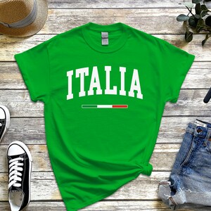 May include: Green t-shirt with white text that says "ITALIA" and a small Italian flag graphic.