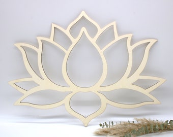 May include: A wooden cutout of a lotus flower, a symbol of purity and enlightenment. The cutout is made of light-colored wood and has a delicate, intricate design.