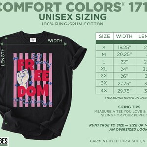 May include: Black unisex t-shirt with a graphic design that reads "250 Years of Freedom" in red and white, with a raised fist graphic. The shirt includes a size chart with measurements in inches. Made of 100% ring-spun cotton.