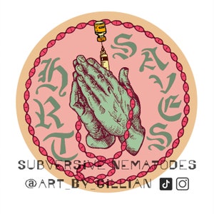 May include: A pink circle with a red rosary around the edge. The rosary is made of small oval beads. Inside the circle, two hands are clasped in prayer. A syringe is attached to a small bottle and is being injected into the clasped hands. The text "SALVATION" is written in a gothic font around the hands. The text "SUBVERSIVE NEMATODES @ART_BY_GILLIAN" is written below the circle. There are social media icons to the right of the text.