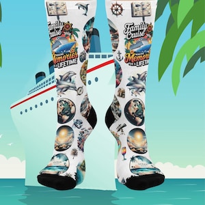 May include: White socks with a black heel and toe, featuring a cruise ship design with the text "Family Cruise 2026" and "Making Memories for a Lifetime." The socks are decorated with dolphins, globes, and ocean scenes.