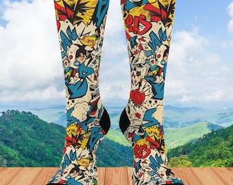 May include: A pair of colorful socks with a comic book design. The socks feature a variety of colors, including red, yellow, blue, and green. The design includes speech bubbles, sound effects, and other comic book elements.