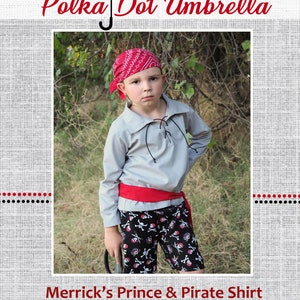 May include: A young boy wearing a grey pirate shirt with a red sash, black and white skull and crossbones pants, and a red bandana. The text "Merrick's Prince & Pirate Shirt" is at the bottom of the image.