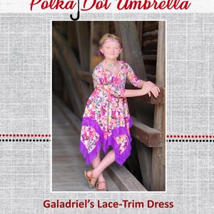 May include: A purple and floral print dress with lace trim. The dress has a high neckline and long sleeves. The dress is asymmetrical and has a longer hem in the back. The dress is called "Galadriel's Lace-Trim Dress" and is part of the "Polka Dot Umbrella" collection.