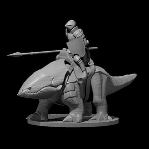 May include: A gray miniature of a knight riding a large, reptilian creature. The knight is armored and holds a spear and shield. The creature has a large head, armored plates, and a long tail. The miniature is on a round base.