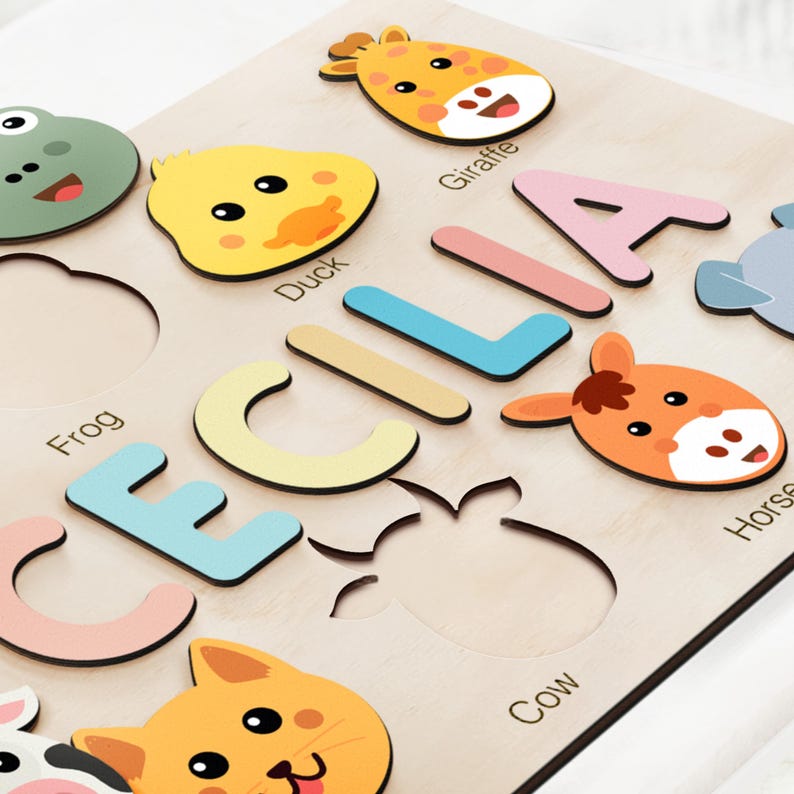 a close up of a wooden sign with animals on it