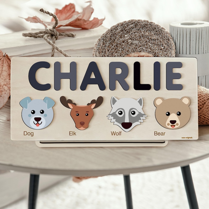 a picture of a wooden name board with animals on it