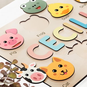 a close up of a cutting board with cut out animals