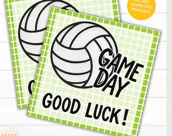 May include: Two square gift tags with a volleyball graphic. The tags have a light green grid background and a white volleyball with black outlines. Text on the tags reads "GAME DAY GOOD LUCK!" and "INSTANT DOWNLOAD PRINTABLE". Each tag is 4"x4".