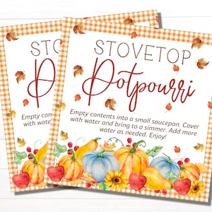 May include: Two printable signs with a gingham background and fall-themed illustrations. The text on the signs reads "Stovetop Potpourri" and "Empty contents into a small saucepan. Cover with water and bring to a simmer. Add more water as needed. Enjoy!"