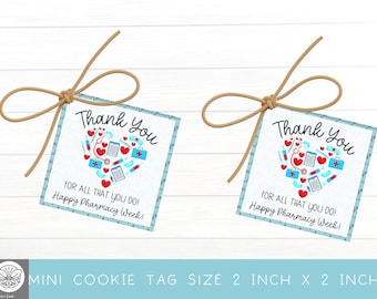 May include: Two blue and white mini cookie tags with a heart-shaped design filled with pharmacy-related icons. The text on the tags reads "Thank You for all that you do! Happy Pharmacy Week!" The tags are 2 inches by 2 inches.
