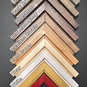 May include: A display of thick border floating frame samples in various colors and finishes. Colors include black, gray, brown, red, white, gold, and green. Finishes include gloss and matte. Text on the image reads "Thick Border Floating Frame."