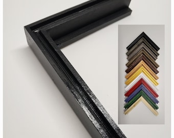 May include: A black wooden picture frame corner, showcasing the corner joint and grooved design. A smaller image displays a variety of frame colors, including gold, red, and green. The frame is designed for artwork or photographs.