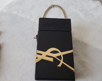 Super Yves Saint Laurent clutch in black vegan leather with gold metal logo
