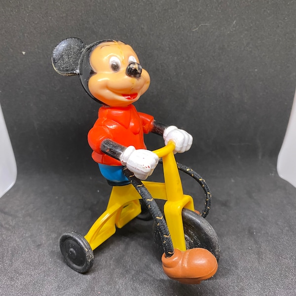 Vintage 1977 Disney Plastic Mickey Mouse on a tricycle bike toy.