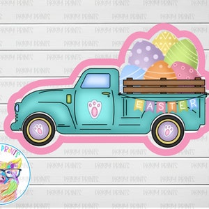 May include: A teal blue pickup truck with a wooden bed filled with pastel Easter eggs. The truck has a paw print on the side and a banner that says "EASTER".