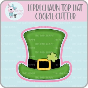 May include: Green and black cookie cutter shaped like a leprechaun's top hat with a shamrock on top. The text "LEPRECHAUN TOP HAT COOKIE CUTTER" is at the top of the image.
