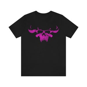 May include: Black t-shirt with a pink skull and horns graphic.