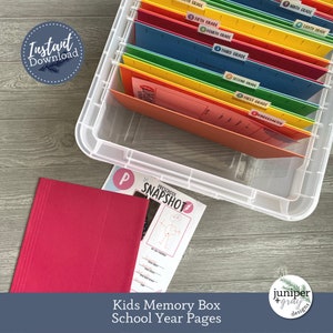 May include: A clear plastic storage box with colorful file folders labeled with grade levels from Kindergarten to Ninth Grade. The box is filled with colorful file folders. A pink folder with a preschool snapshot form is in the foreground.