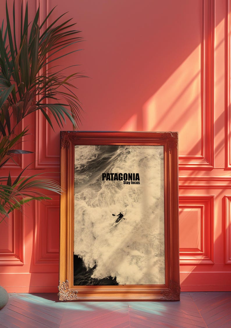 A paddler navigating rough ocean waves in a retro sepia tone. The phrase Patagonia Stay Focus highlights concentration and adventure. Perfect for water sports lovers and those seeking wilderness-inspired decor.