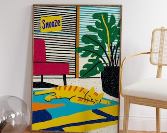 May include: A framed illustration of a cat sleeping on a colorful rug in a room with a red chair, a potted plant, and a sign that says "Snooze".