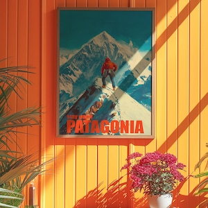 A striking poster featuring a climber in bright orange gear standing on a snowy mountain peak in Patagonia. This adventurous design captures the spirit of exploration and the beauty of the outdoors, perfect for nature lovers and thrill seekers.