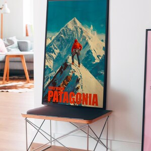A striking poster featuring a climber in bright orange gear standing on a snowy mountain peak in Patagonia. This adventurous design captures the spirit of exploration and the beauty of the outdoors, perfect for nature lovers and thrill seekers.