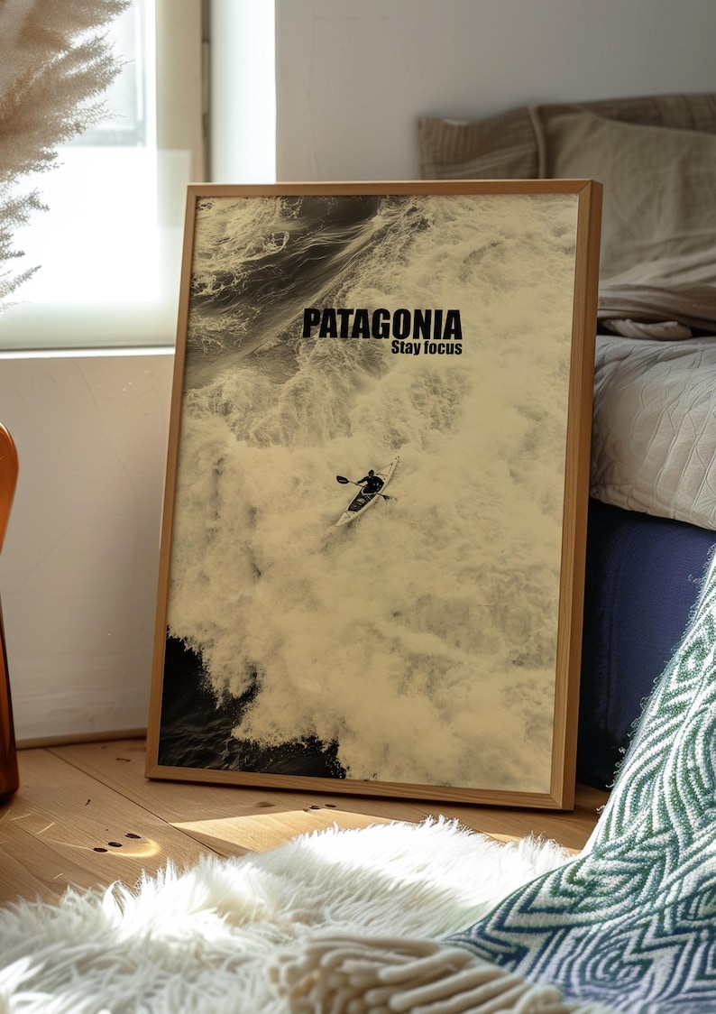 A thrilling poster featuring a paddler navigating intense whitewater rapids with the text Patagonia Stay Focus. This bold and adventurous design is perfect for extreme sports lovers and outdoor enthusiasts looking for dynamic wall decor.